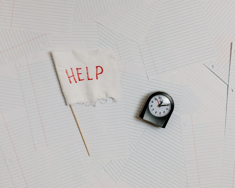 Clock beside tax paperwork